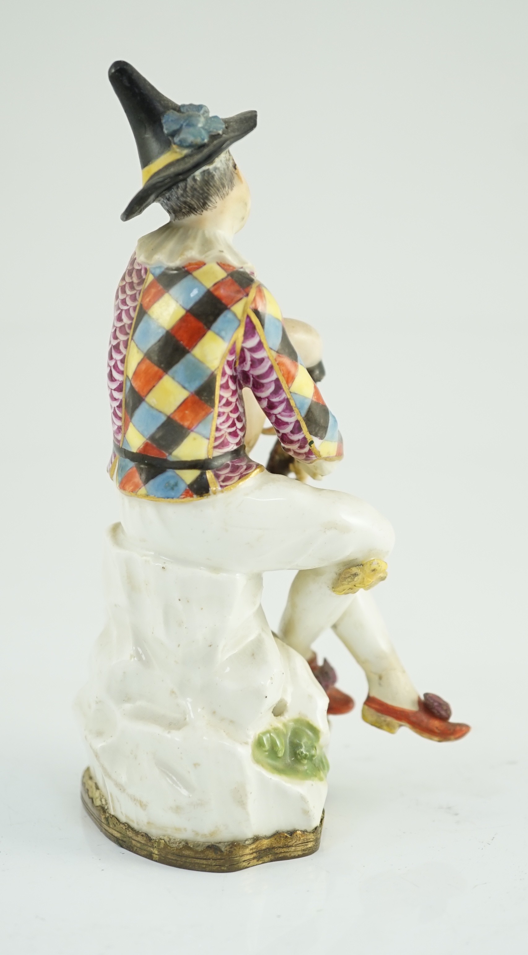 A Meissen porcelain figure of a seated bagpiper, mid 18th century, modelled by J.J. Kandler, 15cm high, restored, Provenance - purchased from Winifred Williams, Eastbourne/London before 1970.